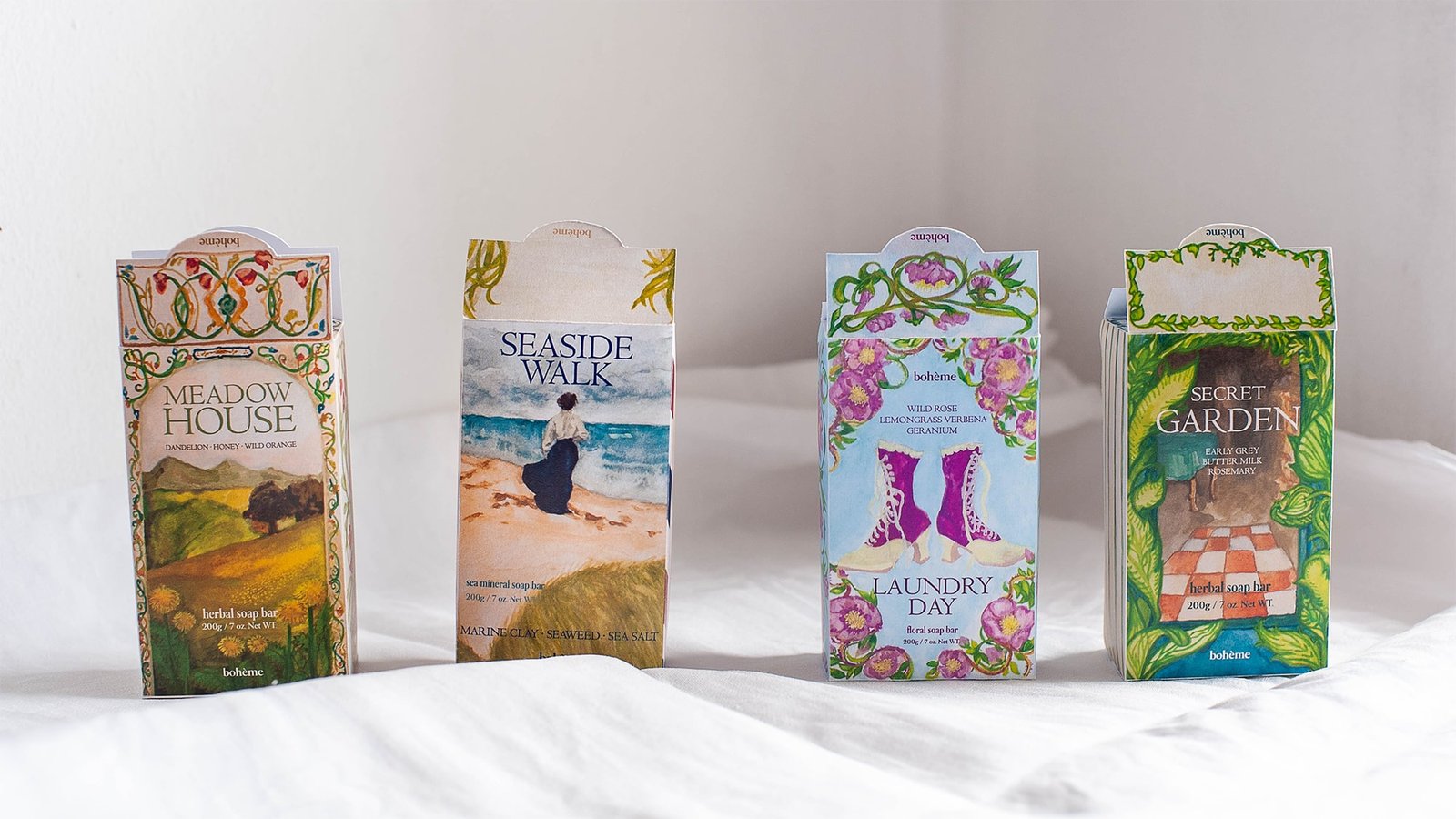 four soap box packaging design for a mock brand, boheme to showcase branding design idea with artwork by studio hyejunahn.